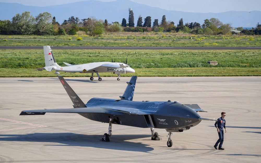 Two unmanned combat aircraft on a runway apron